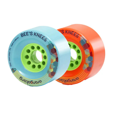 Two colorful skateboard wheels with 'Bee's Knees' branding on a white background.